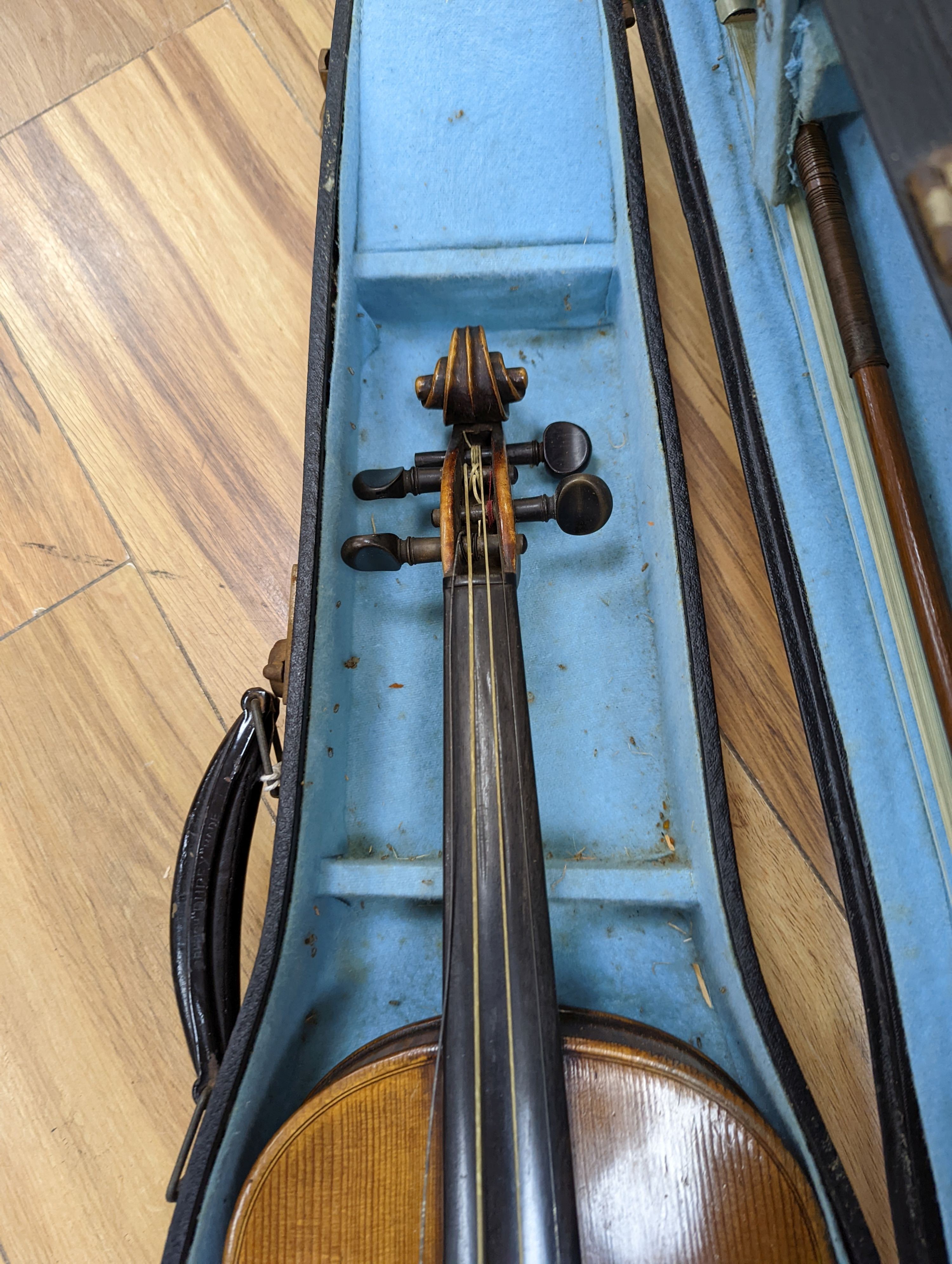 A late 19th century German violin, case, 60 cms long.